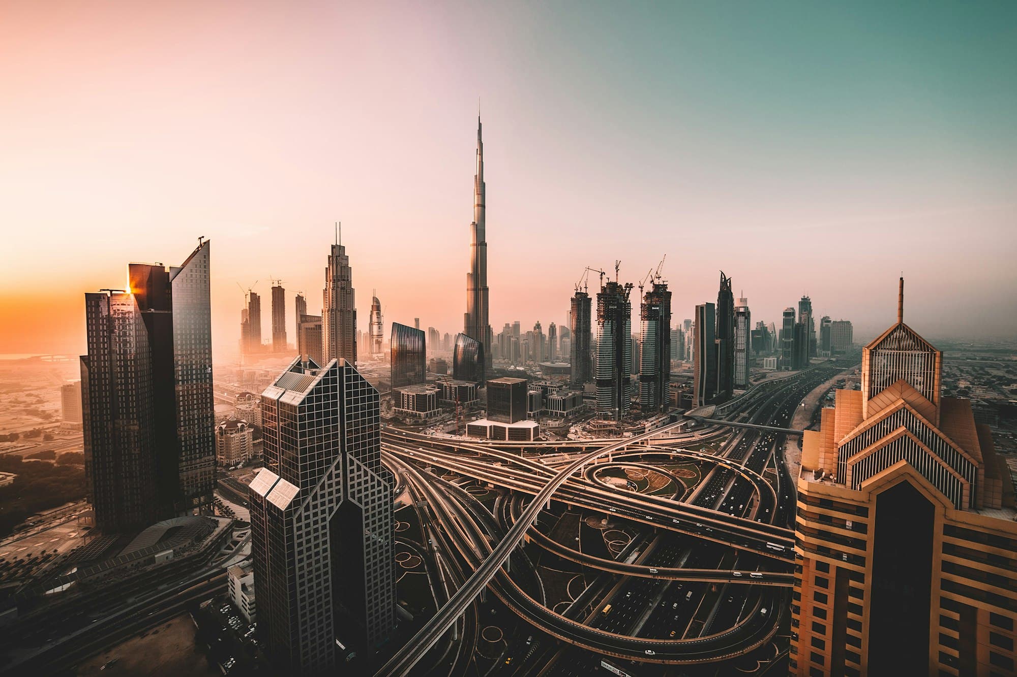Downtown Dubai at dusk, with Burj Khalifa at the center of the skyline